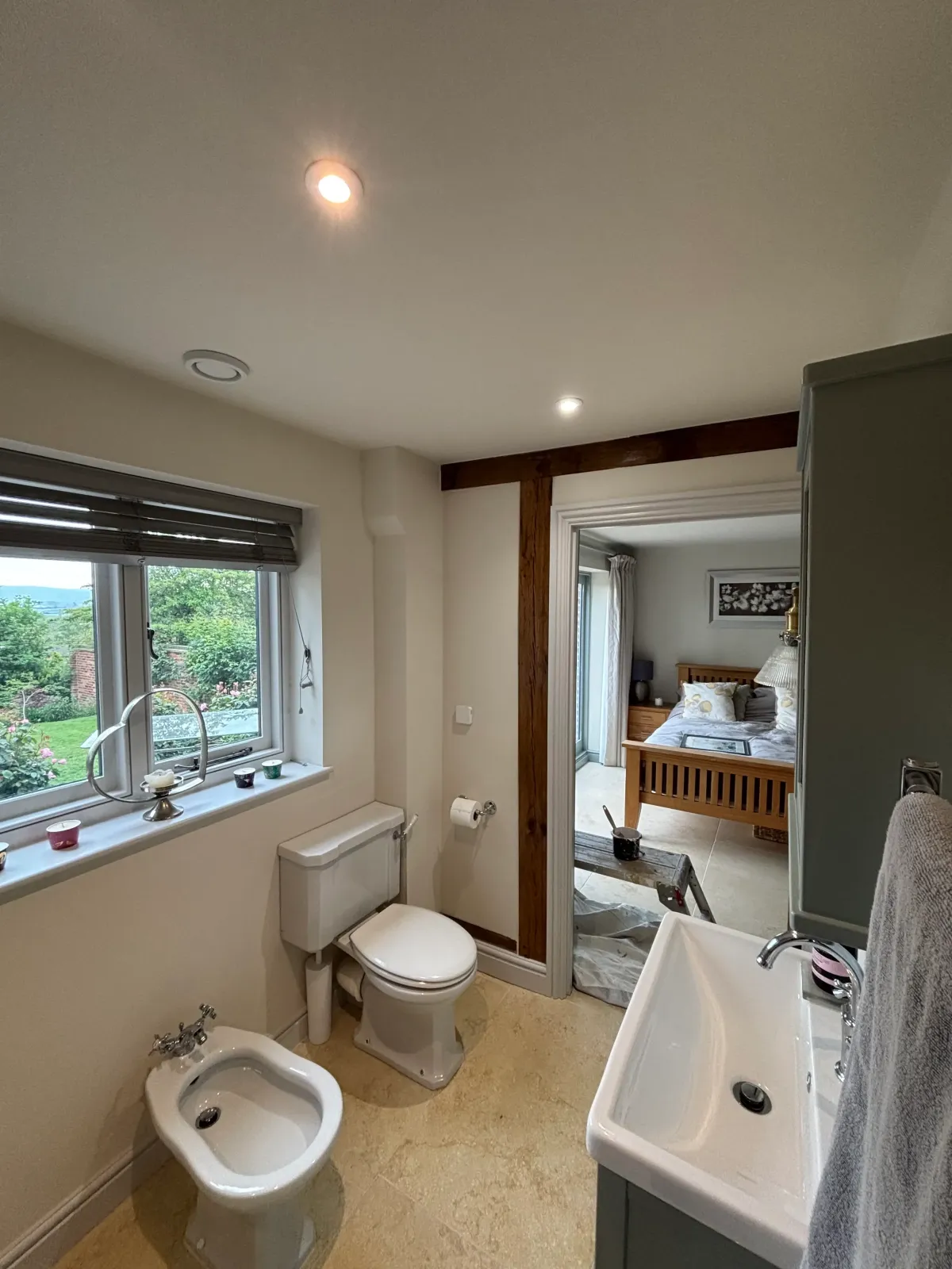 Bright bathroom with painted walls and countryside views