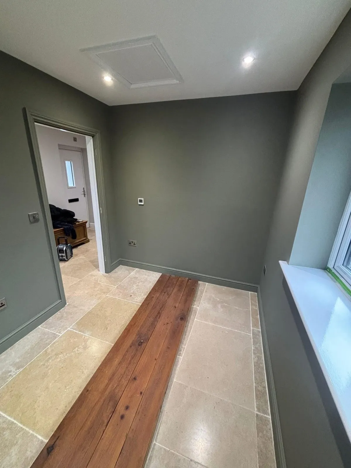 Green colour-drenched room painted by RGM Paint & Decorating